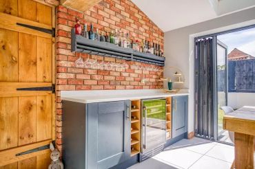 Kitchen with exposed brick wall