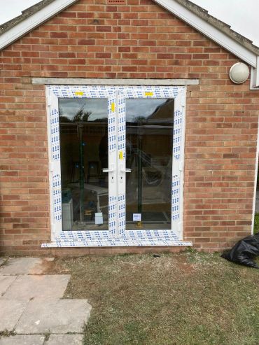 Brick facade with new door installation