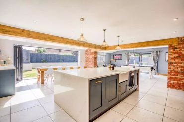 Open-plan kitchen with glazed doors