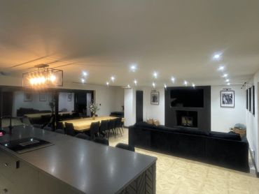 Open-concept living, kitchen and dining wide view